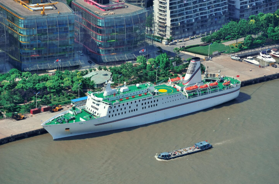 Eco-friendly cruise ship docked at urban port showcasing sustainable travel