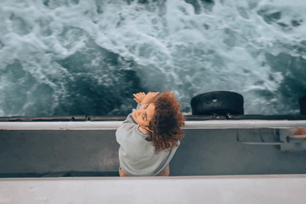 Traveler on a boat staying calm to avoid seasickness during a cruise.