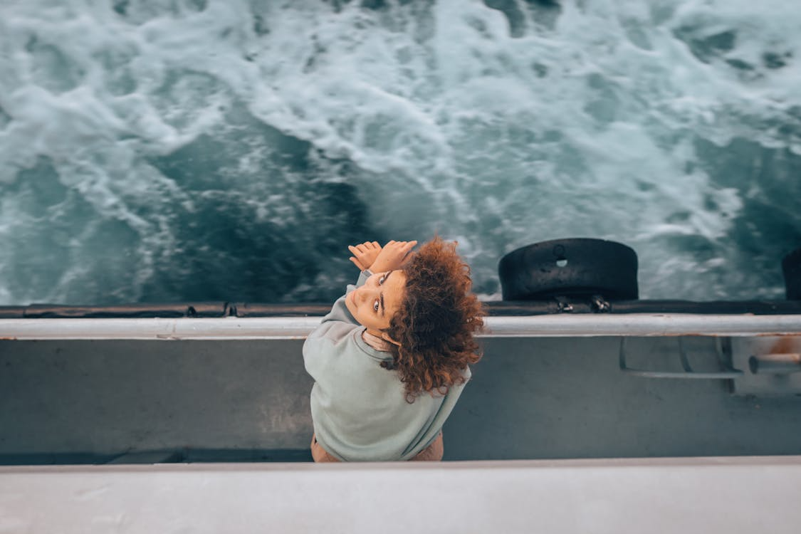 Traveler on a boat staying calm to avoid seasickness during a cruise.