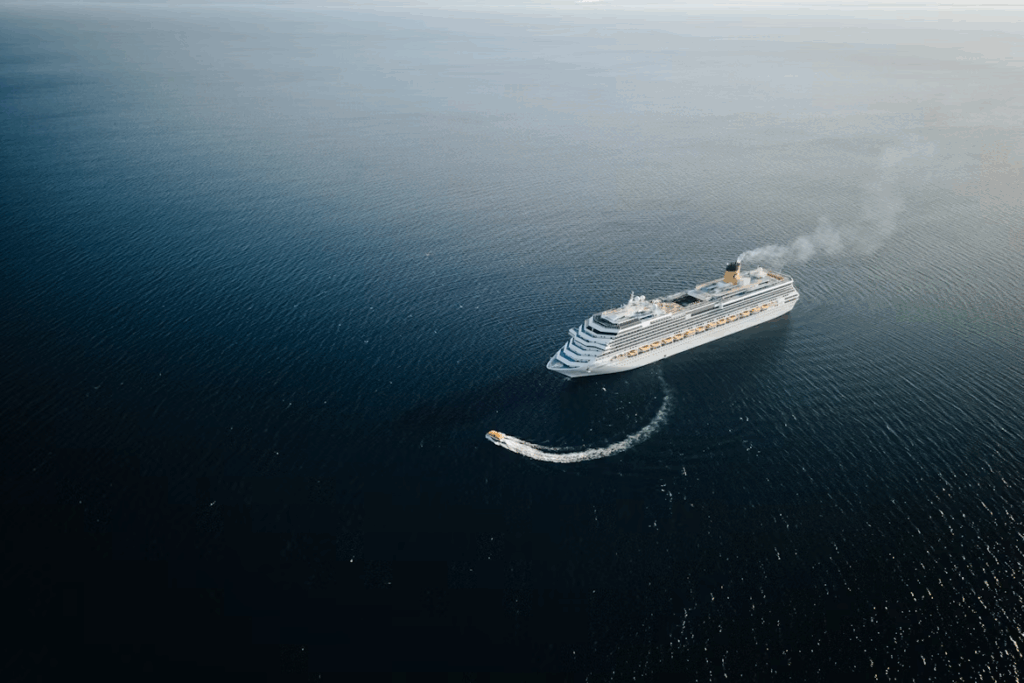 Aerial view of a cruise ship sailing across the Atlantic Ocean during a transatlantic voyage
