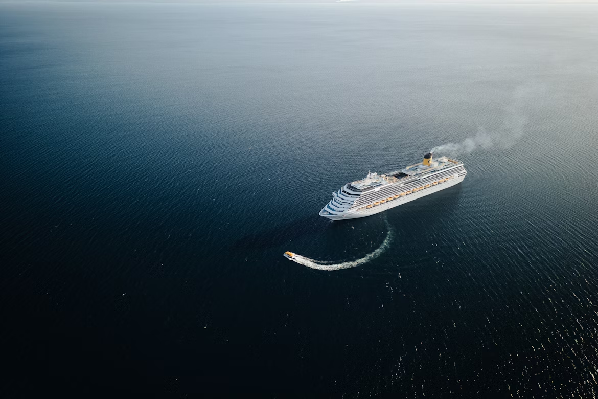 Aerial view of a cruise ship sailing across the Atlantic Ocean during a transatlantic voyage
